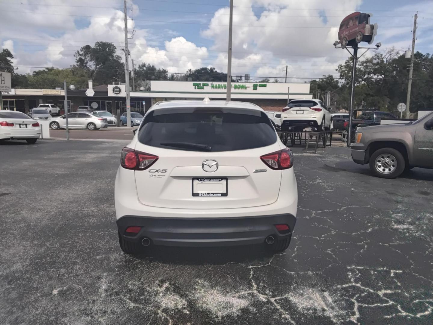 2014 White /Black Mazda CX-5 Sport AT (JM3KE2BE0E0) with an 2.5L L4 DOHC 16V engine, 6-Speed Automatic transmission, located at 6112 N Florida Avenue, Tampa, FL, 33604, (888) 521-5131, 27.954929, -82.459534 - $499 down plus tax & tag. - Photo#3