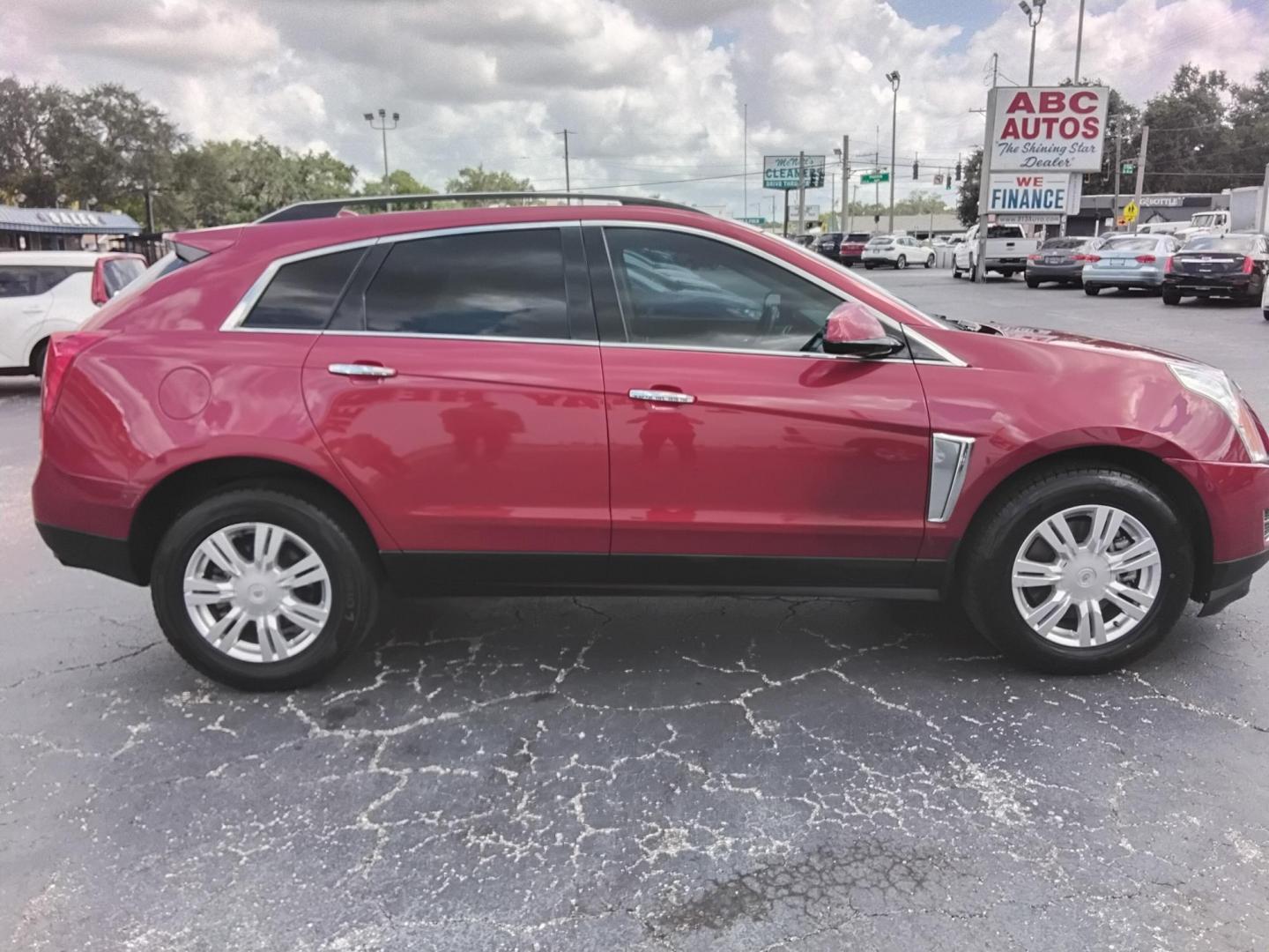 2015 RED /Grey Cadillac SRX Standard FWD (3GYFNAE3XFS) with an 3.6L V6 DOHC 24V FFV engine, 6-Speed Automatic transmission, located at 6112 N Florida Avenue, Tampa, FL, 33604, (888) 521-5131, 27.954929, -82.459534 - $499 down plus tax & tag. - Photo#2