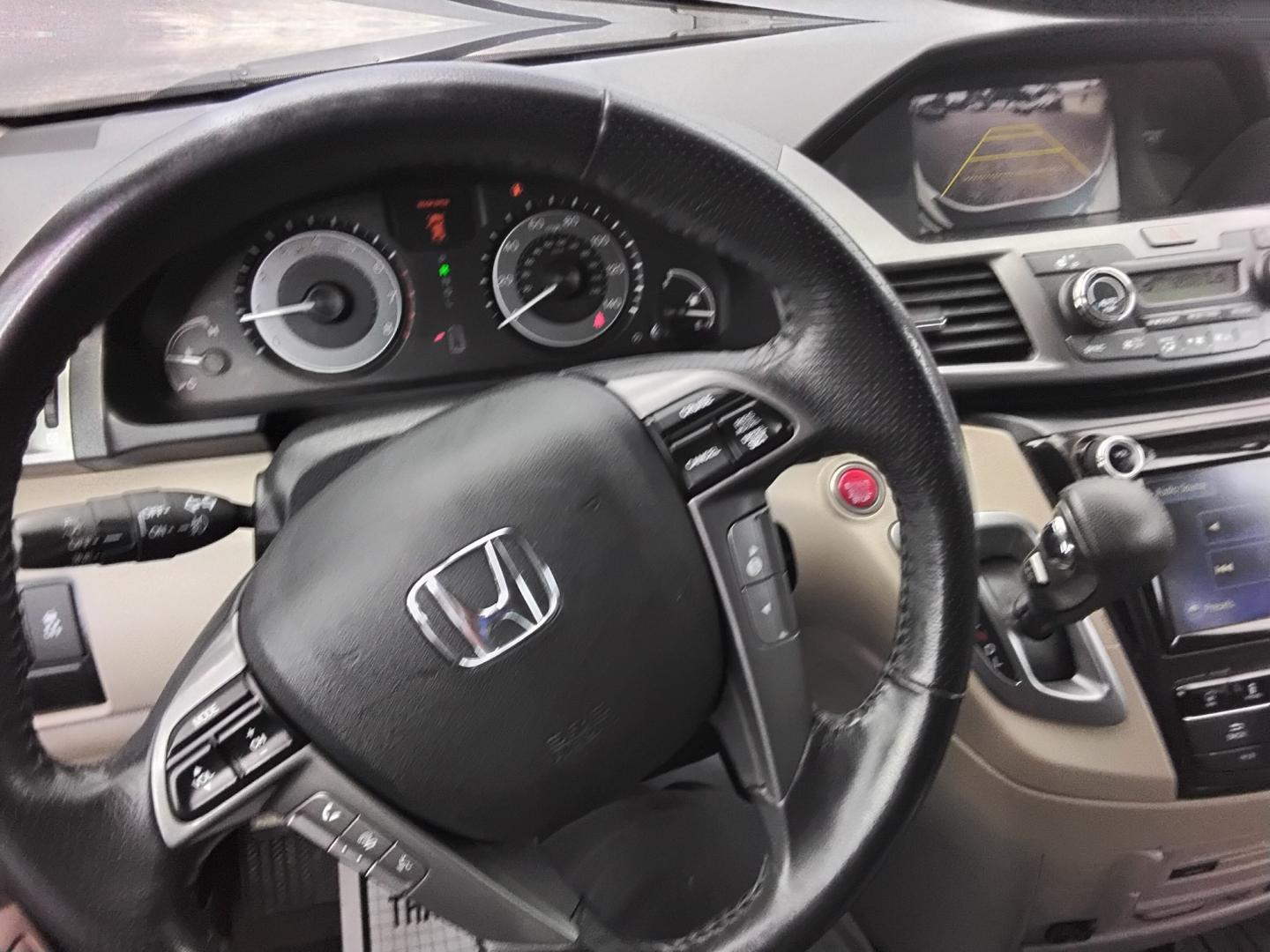 2014 White /Beige Honda Odyssey Touring (5FNRL5H90EB) with an 3.5L V6 SOHC 24V engine, 6-Speed Automatic transmission, located at 6112 N Florida Avenue, Tampa, FL, 33604, (888) 521-5131, 27.954929, -82.459534 - $499 DOWN PLUS TAX & TAG.- Photo#7