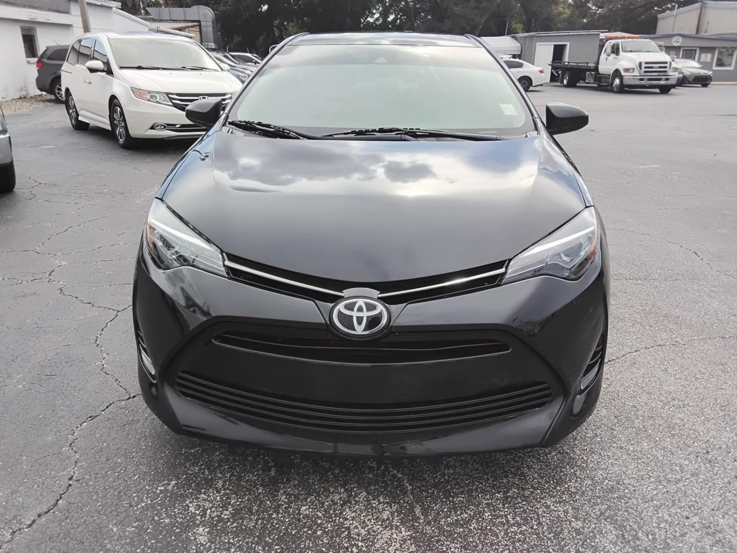 2019 BLACK /Beige Toyota Corolla L CVT (5YFBURHE5KP) with an 1.8L L4 DOHC 16V engine, CVT transmission, located at 6112 N Florida Avenue, Tampa, FL, 33604, (888) 521-5131, 27.954929, -82.459534 - $499 DOWN PLUS TAX & TAG.- Photo#1