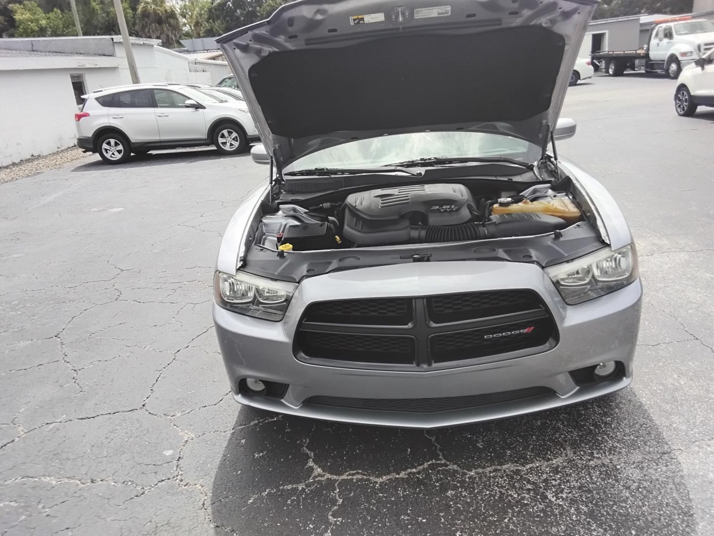 2014 SILVER /Black Dodge Charger SXT (2C3CDXHG0EH) with an 3.6L V6 DOHC 24V engine, 8-Speed Automatic transmission, located at 6112 N Florida Avenue, Tampa, FL, 33604, (888) 521-5131, 27.954929, -82.459534 - $499 DOWN PLUS TAX & TAX.- Photo#12