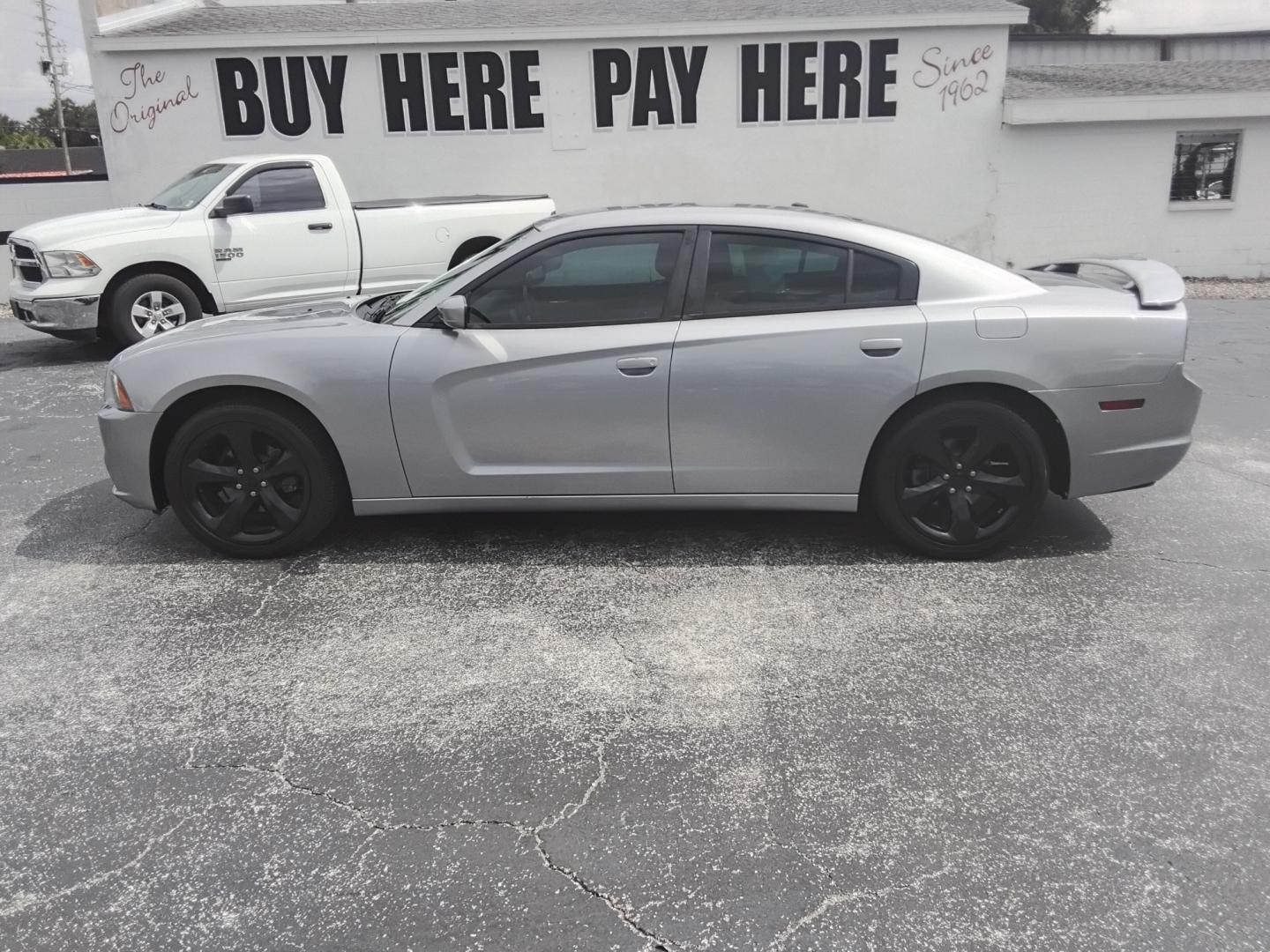 2014 SILVER /Black Dodge Charger SXT (2C3CDXHG0EH) with an 3.6L V6 DOHC 24V engine, 8-Speed Automatic transmission, located at 6112 N Florida Avenue, Tampa, FL, 33604, (888) 521-5131, 27.954929, -82.459534 - $499 DOWN PLUS TAX & TAX.- Photo#0