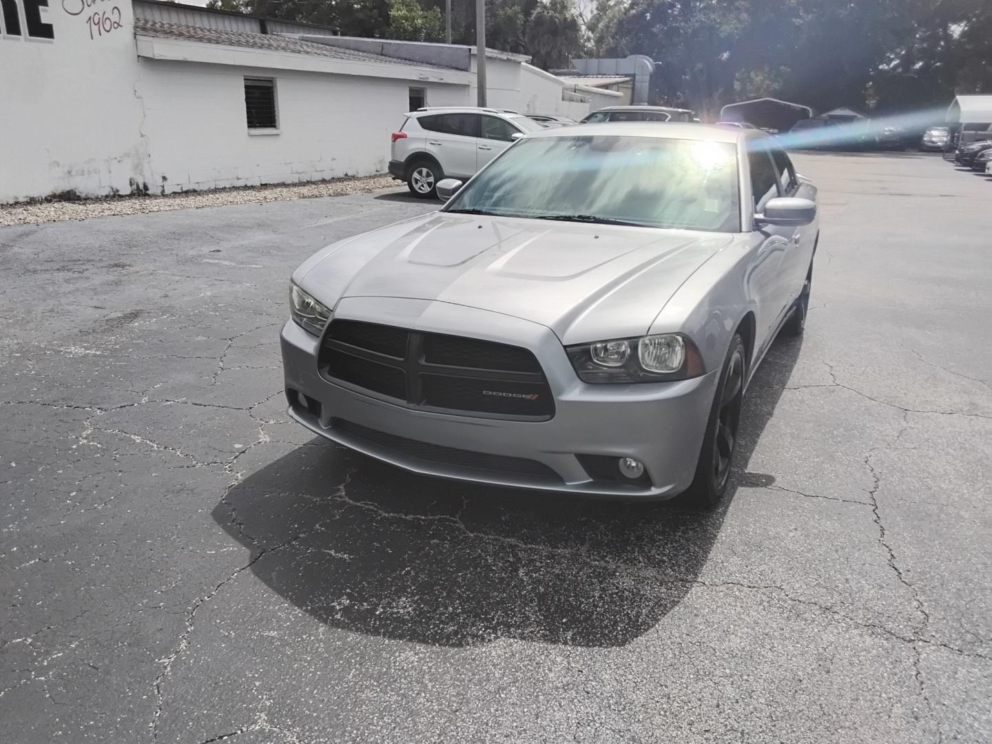 2014 SILVER /Black Dodge Charger SXT (2C3CDXHG0EH) with an 3.6L V6 DOHC 24V engine, 8-Speed Automatic transmission, located at 6112 N Florida Avenue, Tampa, FL, 33604, (888) 521-5131, 27.954929, -82.459534 - $499 DOWN PLUS TAX & TAX.- Photo#1