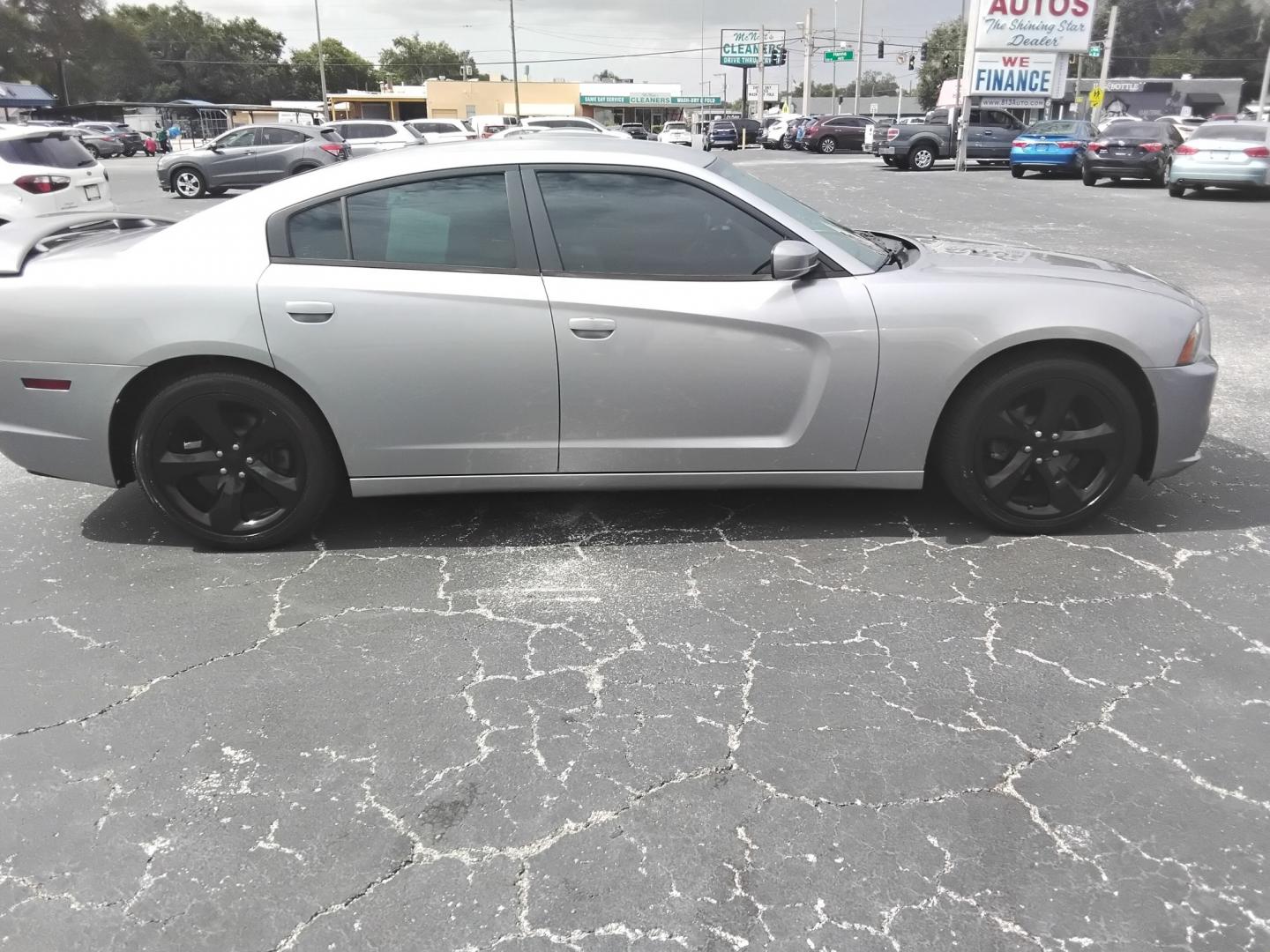 2014 SILVER /Black Dodge Charger SXT (2C3CDXHG0EH) with an 3.6L V6 DOHC 24V engine, 8-Speed Automatic transmission, located at 6112 N Florida Avenue, Tampa, FL, 33604, (888) 521-5131, 27.954929, -82.459534 - $499 DOWN PLUS TAX & TAX.- Photo#4