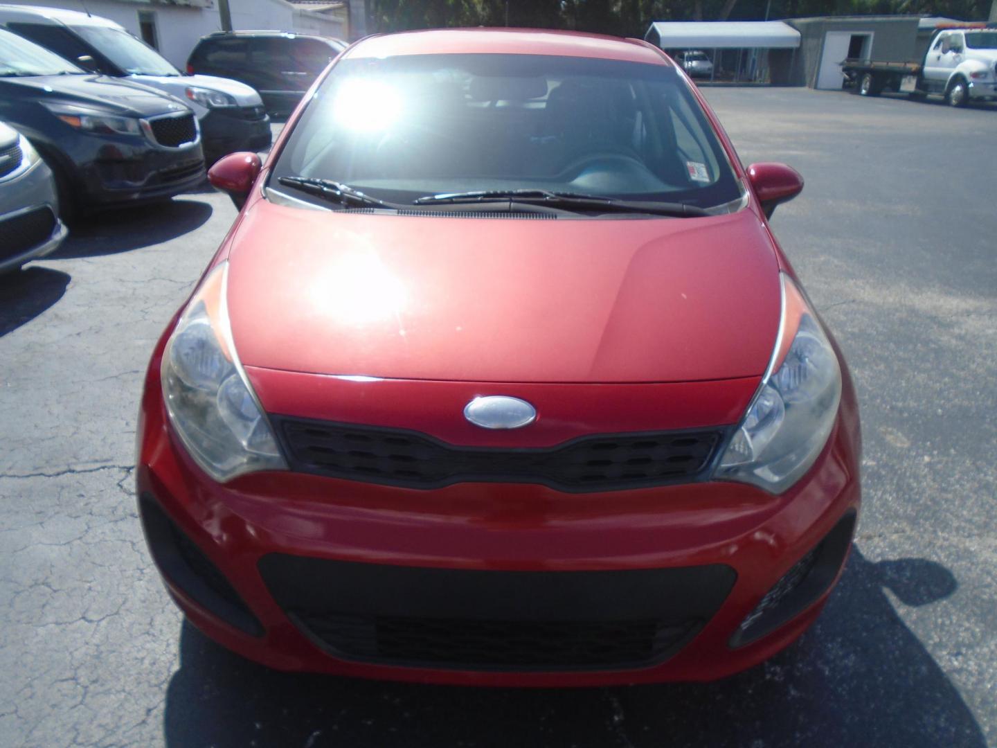 2014 Red Kia Rio LX (KNADM5A32E6) with an 4-Cyl, 1.6 Liter engine, Automatic, 6-Spd transmission, located at 6112 N Florida Avenue, Tampa, FL, 33604, (888) 521-5131, 27.954929, -82.459534 - Photo#1