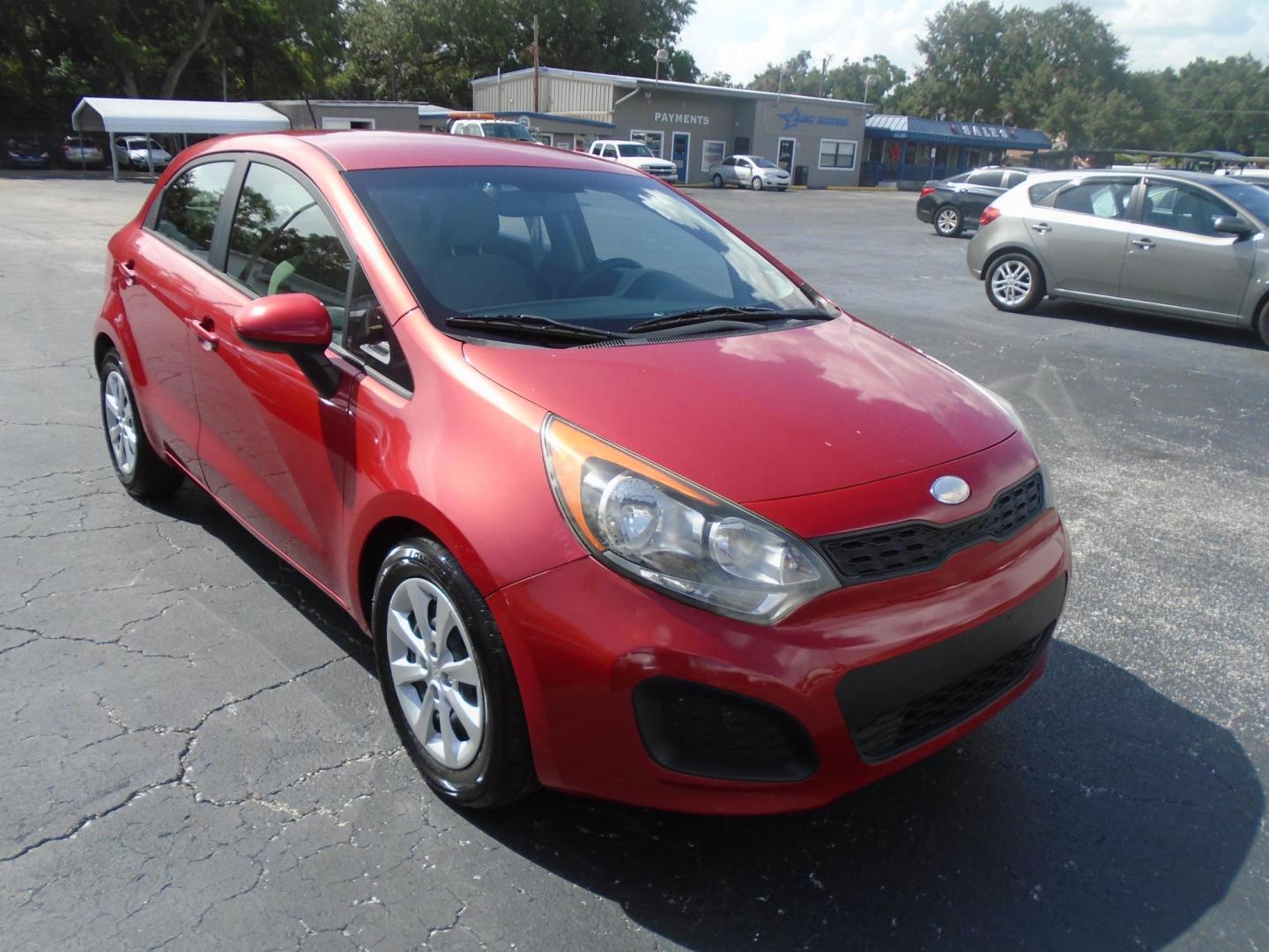 2014 Red Kia Rio LX (KNADM5A32E6) with an 4-Cyl, 1.6 Liter engine, Automatic, 6-Spd transmission, located at 6112 N Florida Avenue, Tampa, FL, 33604, (888) 521-5131, 27.954929, -82.459534 - Photo#2