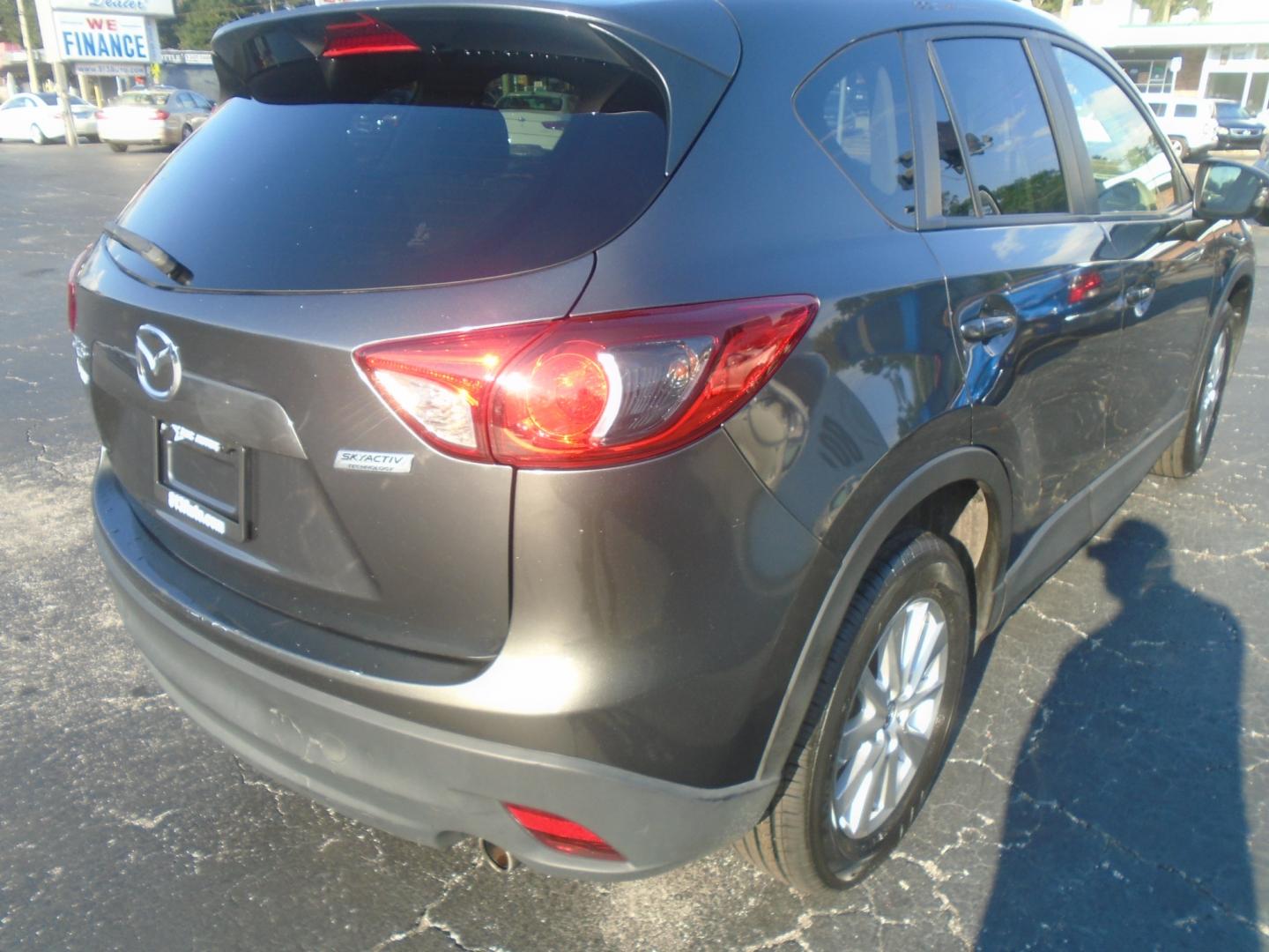 2014 Grey Mazda CX-5 Touring (JM3KE2CY3E0) with an 2.5L L4 DOHC 16V engine, 6-Speed Automatic transmission, located at 6112 N Florida Avenue, Tampa, FL, 33604, (888) 521-5131, 27.954929, -82.459534 - Photo#5