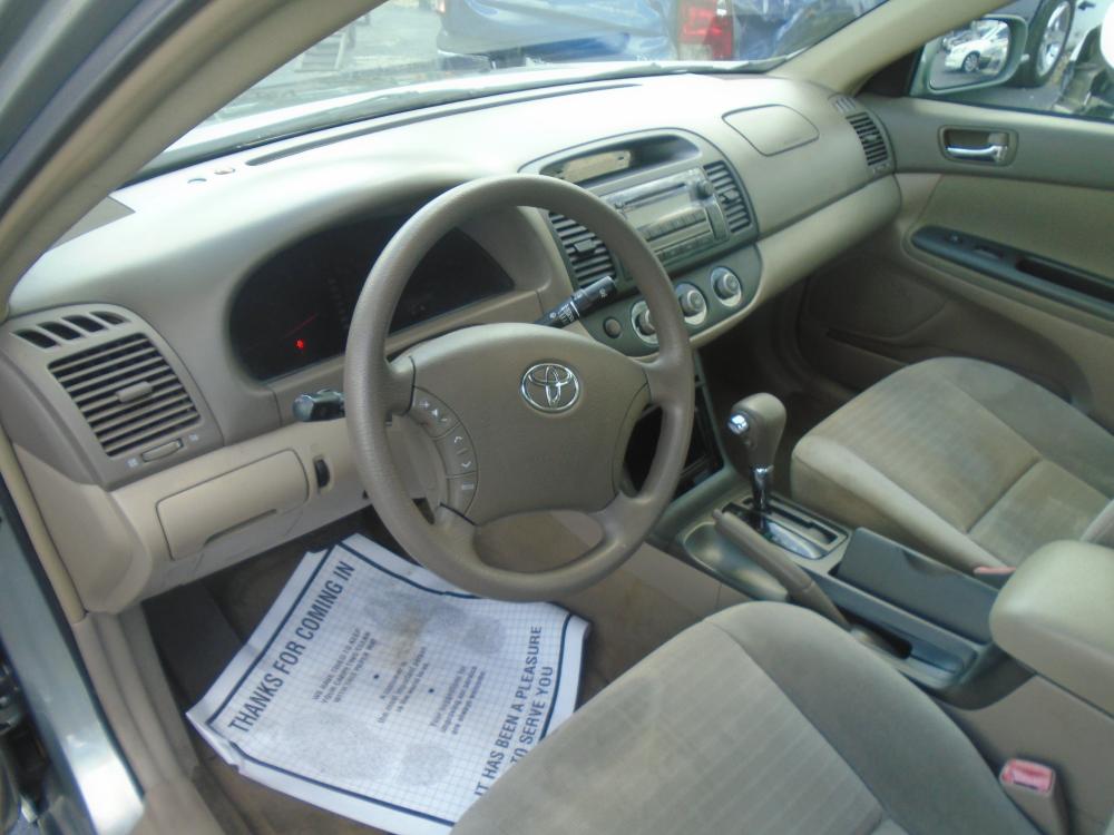 2005 Ivory /Grey Toyota Camry LE (4T1BE30K35U) with an 2.4L L4 DOHC 16V engine, located at 6112 N Florida Avenue, Tampa, FL, 33604, (888) 521-5131, 27.954929, -82.459534 - Photo #6