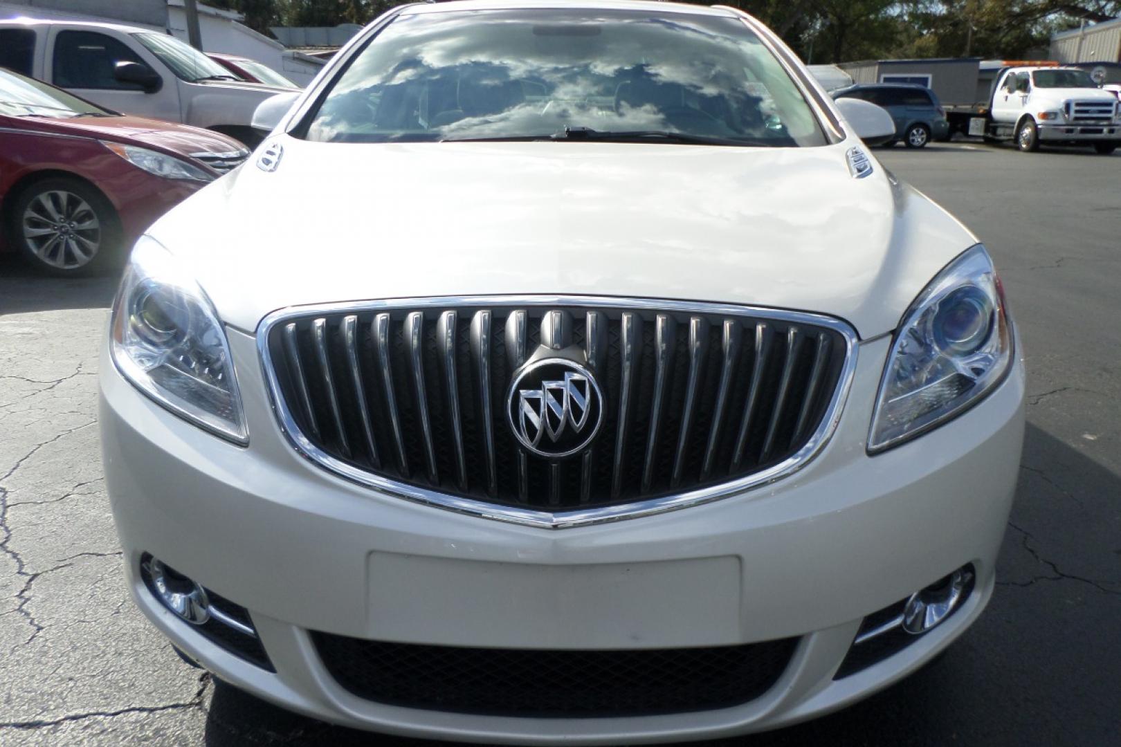 2012 White /Tan Buick Verano Leather (1G4PS5SK5C4) with an 2.4L L4 DOHC 16V FFV engine, 6-Speed Automatic transmission, located at 6112 N Florida Avenue, Tampa, FL, 33604, (888) 521-5131, 27.954929, -82.459534 - Photo#1