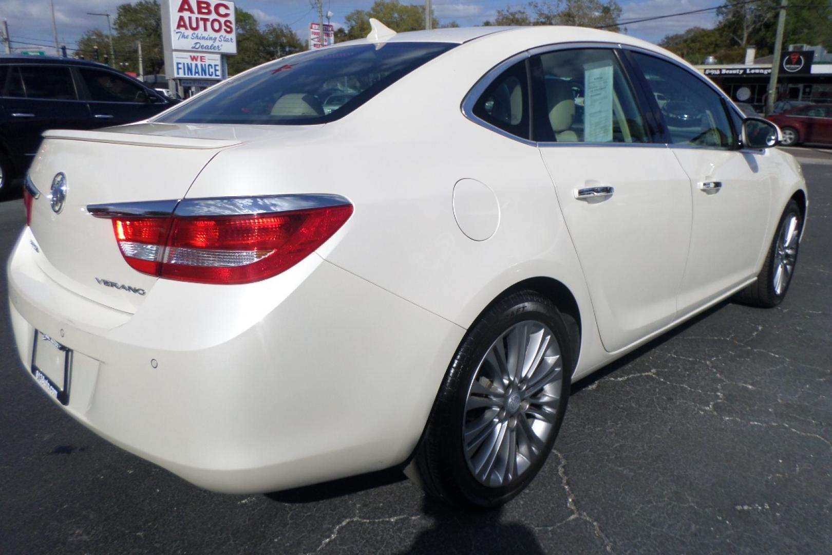 2012 White /Tan Buick Verano Leather (1G4PS5SK5C4) with an 2.4L L4 DOHC 16V FFV engine, 6-Speed Automatic transmission, located at 6112 N Florida Avenue, Tampa, FL, 33604, (888) 521-5131, 27.954929, -82.459534 - Photo#5