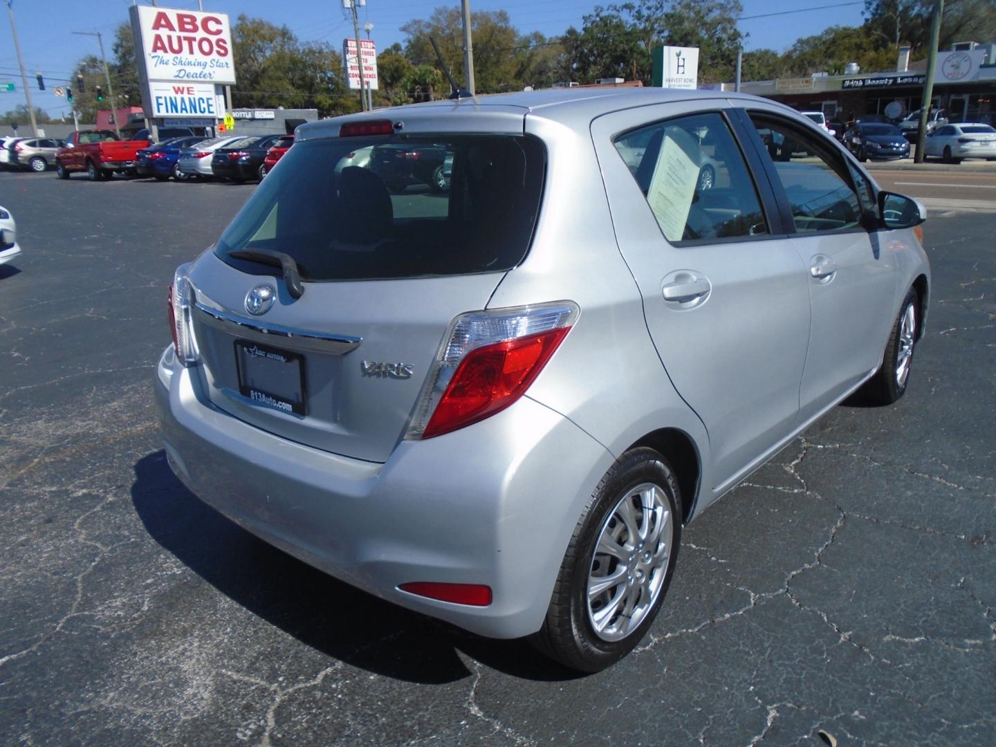 2012 SILVER TOYOTA YARIS (JTDKTUD36CD) with an L4 1.5L DOHC 16V VVT-I engine, located at 6112 N Florida Avenue, Tampa, FL, 33604, (888) 521-5131, 27.954929, -82.459534 - Photo#5