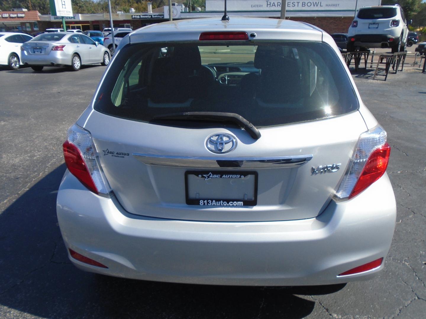 2012 SILVER TOYOTA YARIS (JTDKTUD36CD) with an L4 1.5L DOHC 16V VVT-I engine, located at 6112 N Florida Avenue, Tampa, FL, 33604, (888) 521-5131, 27.954929, -82.459534 - Photo#6