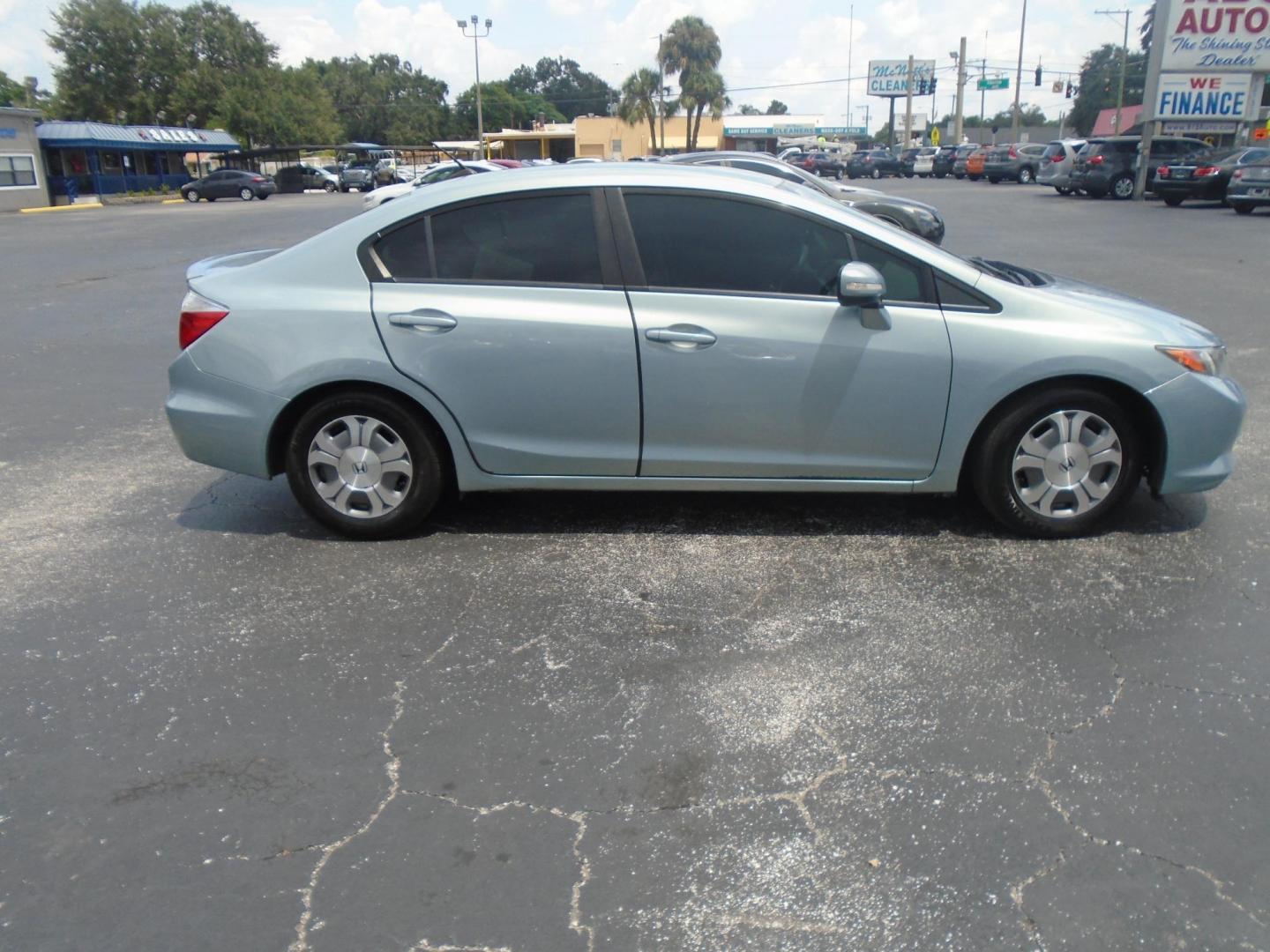 2012 Honda Civic Hybrid CVT AT-PZEV (JHMFB4F26CS) with an 1.3L L4 SOHC 8V HYBRID engine, Continuously Variable Transmission transmission, located at 6112 N Florida Avenue, Tampa, FL, 33604, (888) 521-5131, 27.954929, -82.459534 - Photo#1