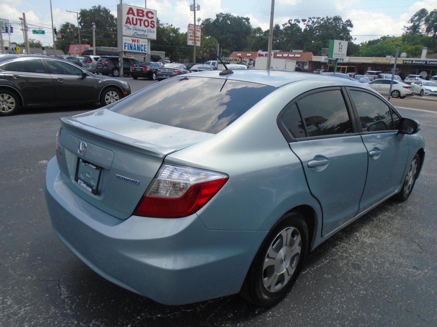 2012 Honda Civic Hybrid CVT AT-PZEV (JHMFB4F26CS) with an 1.3L L4 SOHC 8V HYBRID engine, Continuously Variable Transmission transmission, located at 6112 N Florida Avenue, Tampa, FL, 33604, (888) 521-5131, 27.954929, -82.459534 - Photo#12