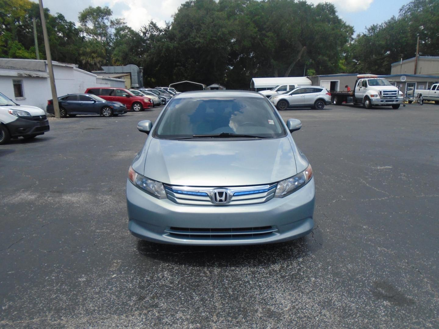 2012 Honda Civic Hybrid CVT AT-PZEV (JHMFB4F26CS) with an 1.3L L4 SOHC 8V HYBRID engine, Continuously Variable Transmission transmission, located at 6112 N Florida Avenue, Tampa, FL, 33604, (888) 521-5131, 27.954929, -82.459534 - Photo#2