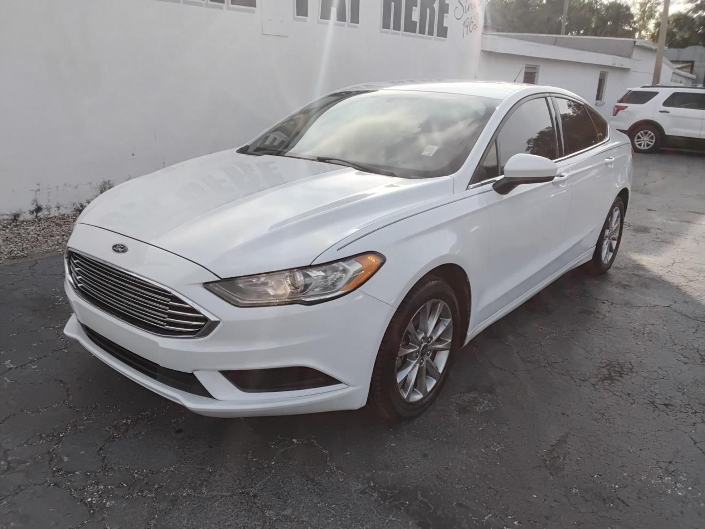 2017 White /Grey Ford Fusion SE (3FA6P0H70HR) with an 2.5L L4 DOHC 16V engine, 6A transmission, located at 6112 N Florida Avenue, Tampa, FL, 33604, (888) 521-5131, 27.954929, -82.459534 - $499 DOWN PLUS TAX & TAG. - Photo#1