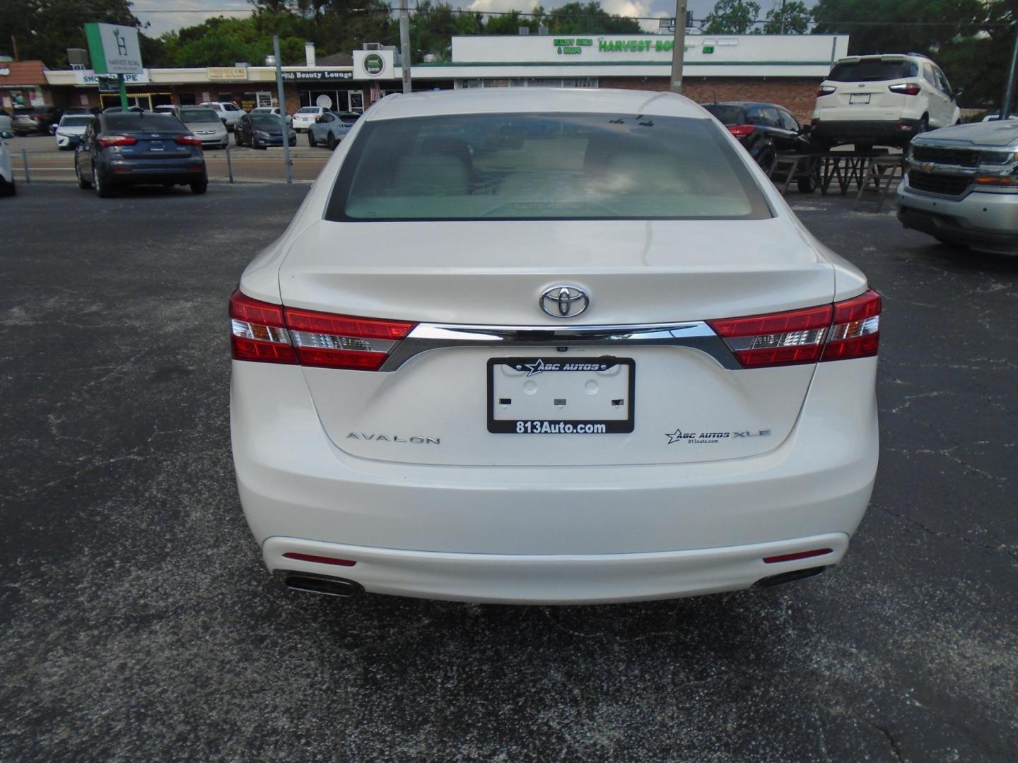 2014 Toyota Avalon XLE (4T1BK1EB1EU) with an 3.5L V6 DOHC 24V engine, 6-Speed Automatic transmission, located at 6112 N Florida Avenue, Tampa, FL, 33604, (888) 521-5131, 27.954929, -82.459534 - Photo#5