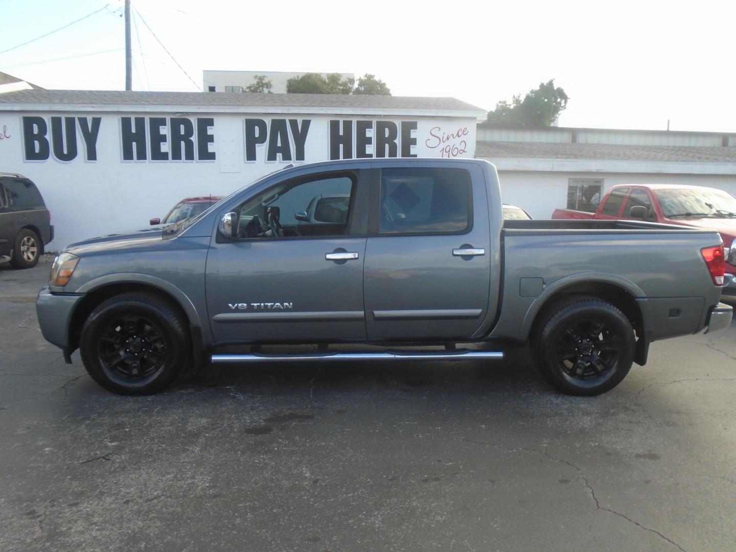 2013 Nissan Titan SV Crew Cab 2WD (1N6BA0ED1DN) with an 5.6L V8 DOHC 32V FFV engine, 5-Speed Automatic transmission, located at 6112 N Florida Avenue, Tampa, FL, 33604, (888) 521-5131, 27.954929, -82.459534 - Photo#0