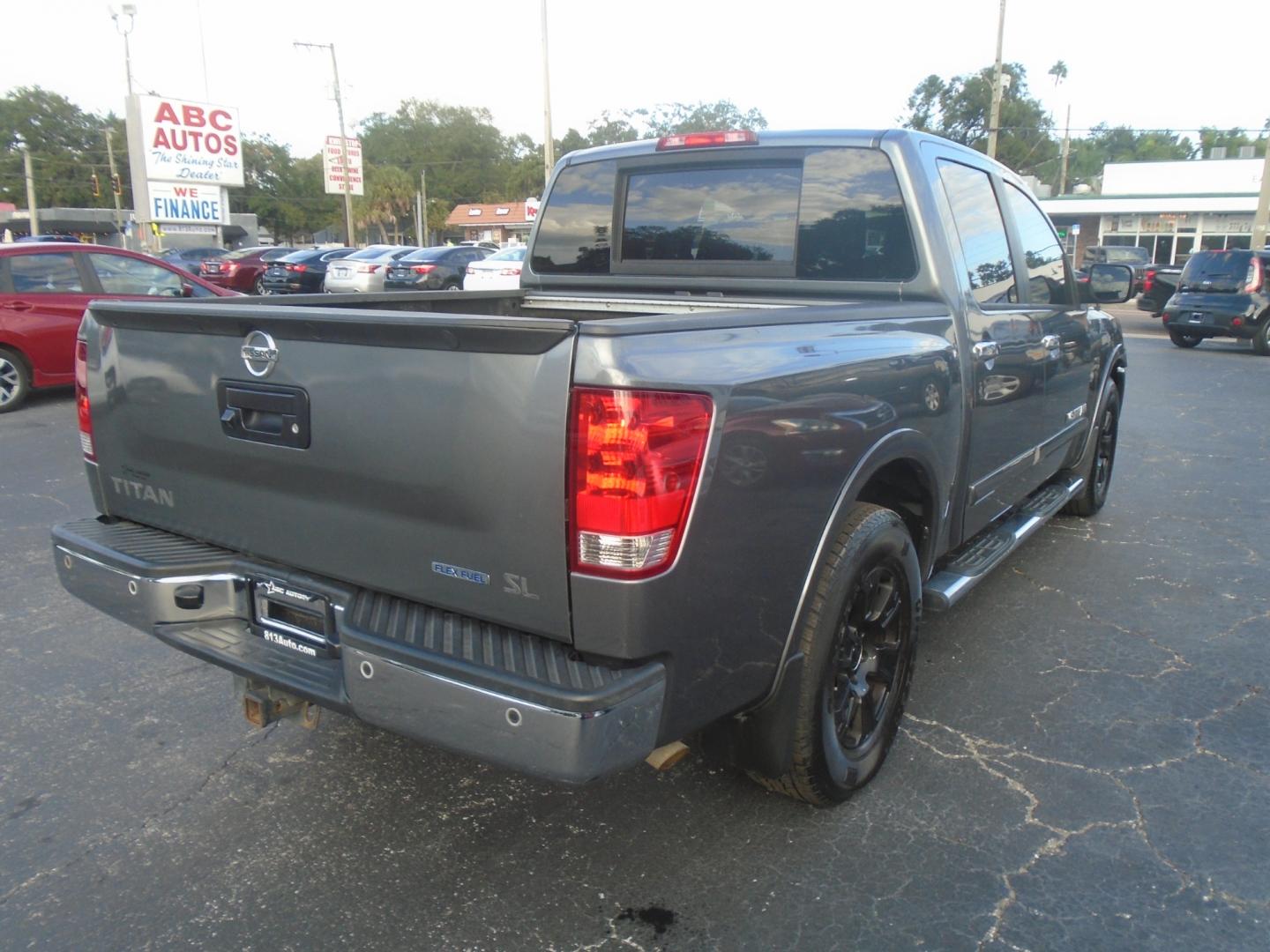 2013 Nissan Titan SV Crew Cab 2WD (1N6BA0ED1DN) with an 5.6L V8 DOHC 32V FFV engine, 5-Speed Automatic transmission, located at 6112 N Florida Avenue, Tampa, FL, 33604, (888) 521-5131, 27.954929, -82.459534 - Photo#6