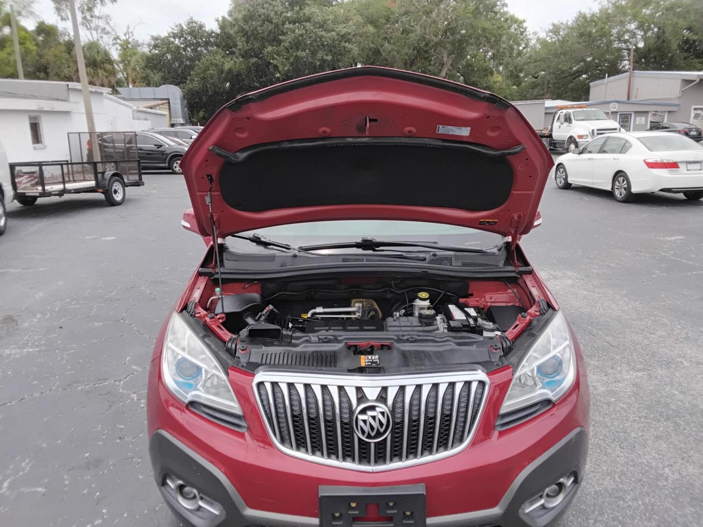 2014 RED /Grey Buick Encore Convenience AWD (KL4CJFSB7EB) with an 1.4L L4 DOHC 16V TURBO engine, 6-Speed Automatic transmission, located at 6112 N Florida Avenue, Tampa, FL, 33604, (888) 521-5131, 27.954929, -82.459534 - $499 DOWN PLUS TAX & TAG.- Photo#7