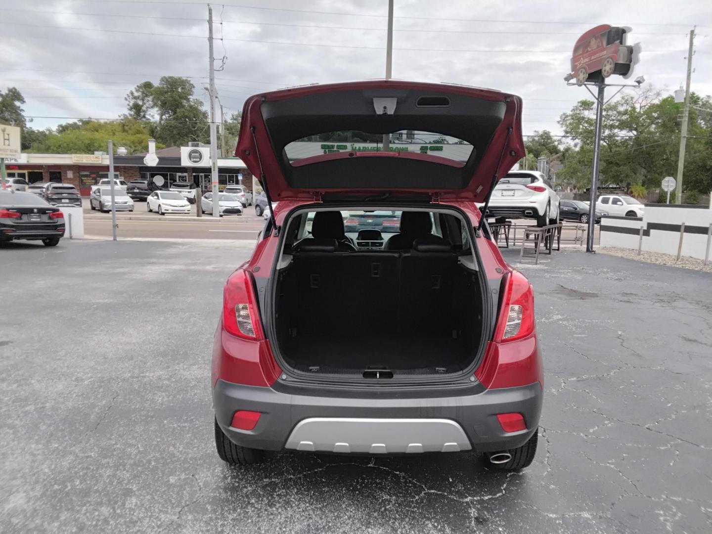 2014 RED /Grey Buick Encore Convenience AWD (KL4CJFSB7EB) with an 1.4L L4 DOHC 16V TURBO engine, 6-Speed Automatic transmission, located at 6112 N Florida Avenue, Tampa, FL, 33604, (888) 521-5131, 27.954929, -82.459534 - $499 DOWN PLUS TAX & TAG.- Photo#2