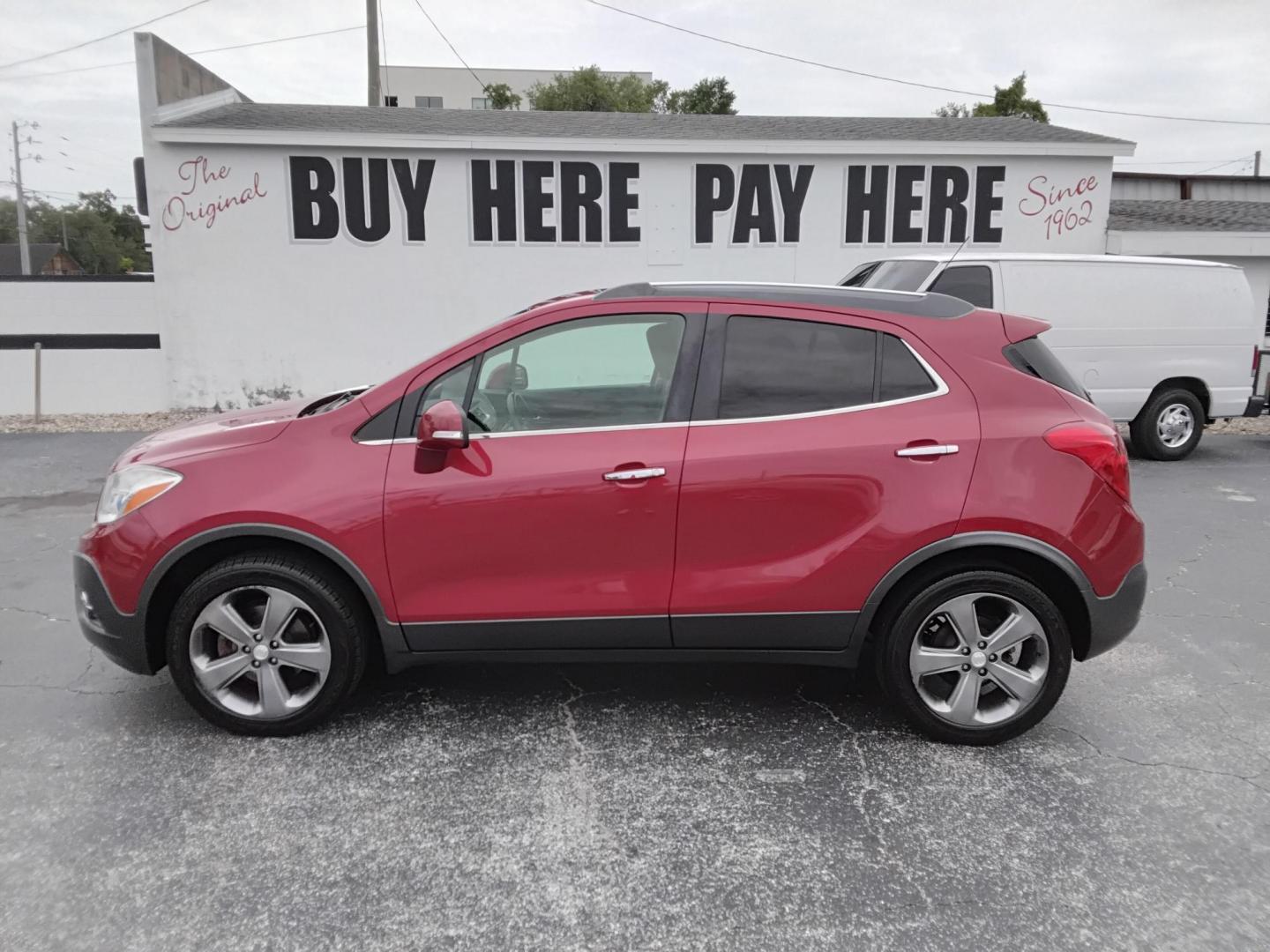 2014 RED /Grey Buick Encore Convenience AWD (KL4CJFSB7EB) with an 1.4L L4 DOHC 16V TURBO engine, 6-Speed Automatic transmission, located at 6112 N Florida Avenue, Tampa, FL, 33604, (888) 521-5131, 27.954929, -82.459534 - $499 DOWN PLUS TAX & TAG.- Photo#1