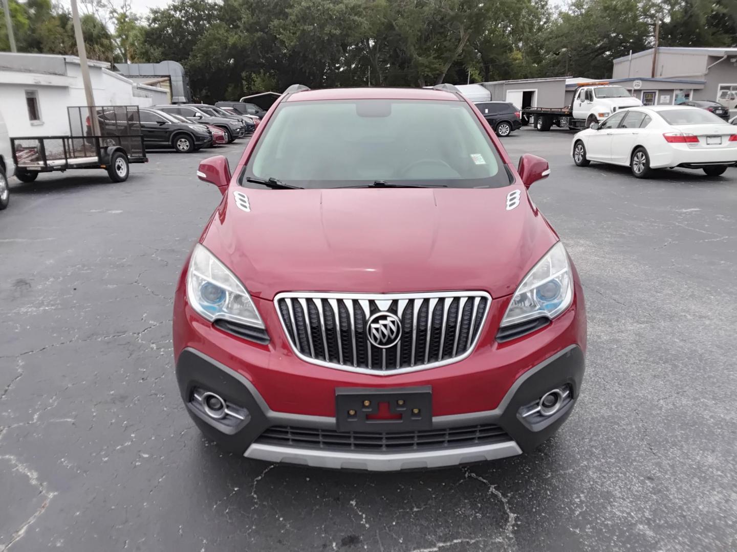2014 RED /Grey Buick Encore Convenience AWD (KL4CJFSB7EB) with an 1.4L L4 DOHC 16V TURBO engine, 6-Speed Automatic transmission, located at 6112 N Florida Avenue, Tampa, FL, 33604, (888) 521-5131, 27.954929, -82.459534 - $499 DOWN PLUS TAX & TAG.- Photo#0