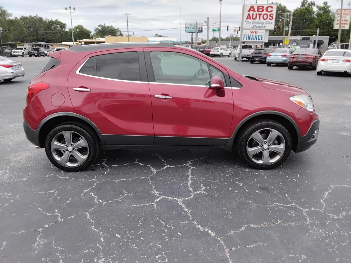 2014 RED /Grey Buick Encore Convenience AWD (KL4CJFSB7EB) with an 1.4L L4 DOHC 16V TURBO engine, 6-Speed Automatic transmission, located at 6112 N Florida Avenue, Tampa, FL, 33604, (888) 521-5131, 27.954929, -82.459534 - $499 DOWN PLUS TAX & TAG.- Photo#3