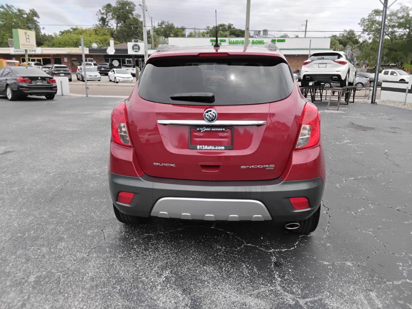 2014 RED /Grey Buick Encore Convenience AWD (KL4CJFSB7EB) with an 1.4L L4 DOHC 16V TURBO engine, 6-Speed Automatic transmission, located at 6112 N Florida Avenue, Tampa, FL, 33604, (888) 521-5131, 27.954929, -82.459534 - $499 DOWN PLUS TAX & TAG.- Photo#4