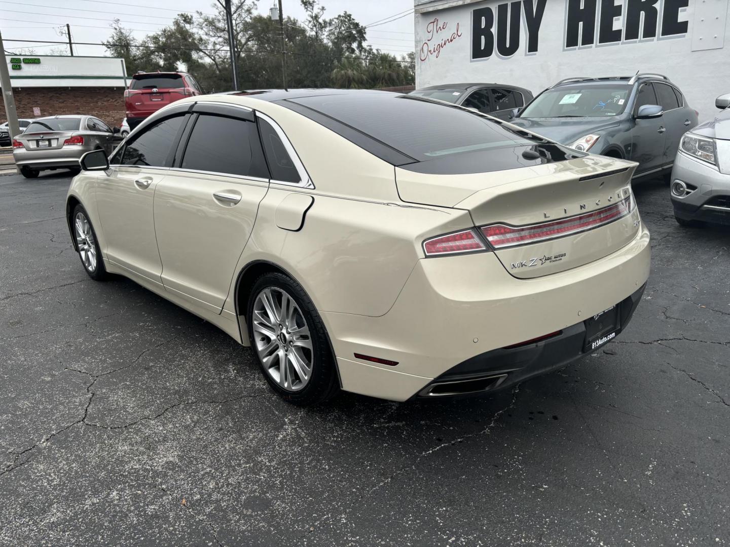 2015 Lincoln MKZ FWD (3LN6L2G91FR) with an 2.0L L4 DOHC 16V engine, 6-Speed Automatic transmission, located at 6112 N Florida Avenue, Tampa, FL, 33604, (888) 521-5131, 27.954929, -82.459534 - Photo#4