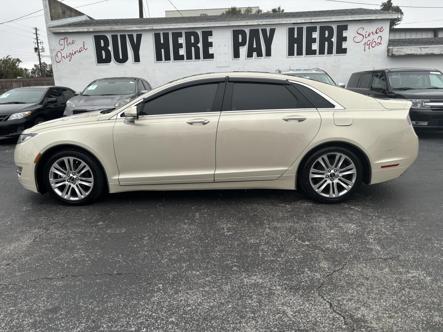 2015 Lincoln MKZ FWD (3LN6L2G91FR) with an 2.0L L4 DOHC 16V engine, 6-Speed Automatic transmission, located at 6112 N Florida Avenue, Tampa, FL, 33604, (888) 521-5131, 27.954929, -82.459534 - Photo#0