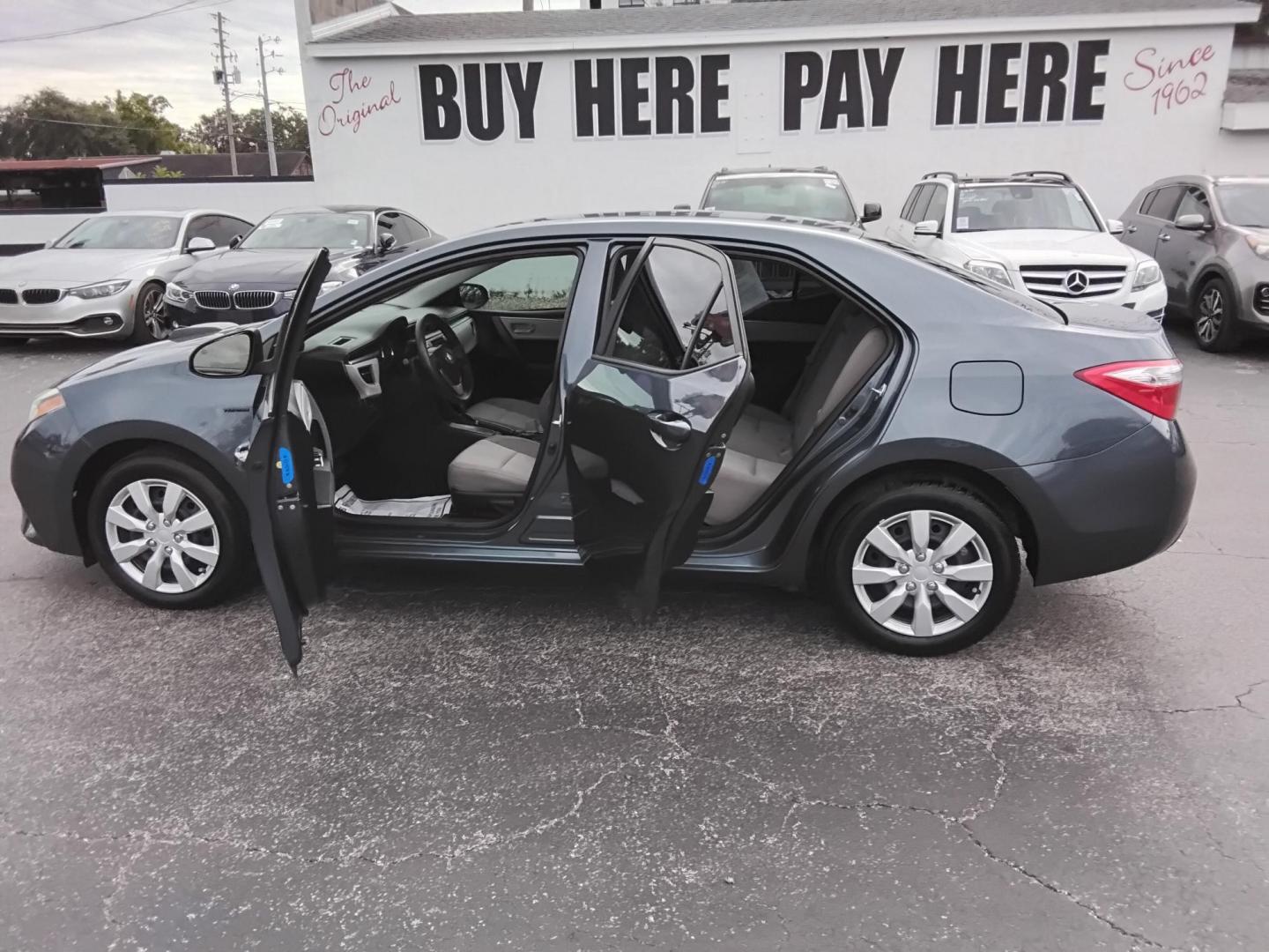 2015 Blue /Grey Toyota Corolla L 4-Speed AT (2T1BURHE8FC) with an 1.8L L4 DOHC 16V engine, 4-Speed Automatic transmission, located at 6112 N Florida Avenue, Tampa, FL, 33604, (888) 521-5131, 27.954929, -82.459534 - 499$ down plus tax & tag. - Photo#1